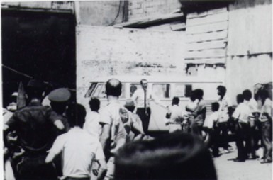 Image of Charles Moore, just prior to being arrested for preaching in the streets.  See the Police Officers on the left of the photo awaiting to arrest Charles.